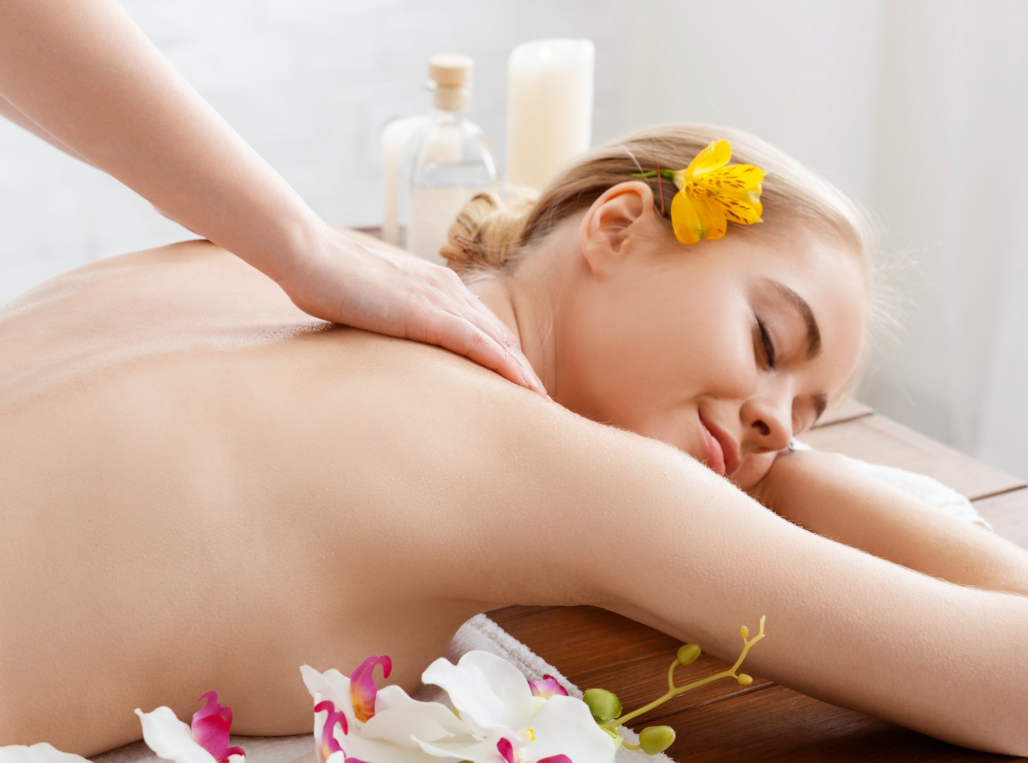 Thai body massage. Enjoying massage smiling girl